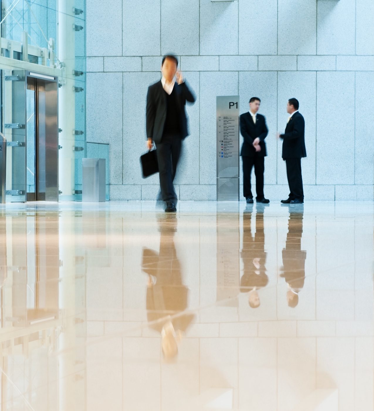 Business people meeting in a modern office lobby
